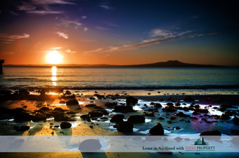 Murrays Bay sun rise, rocks in water - Titan Property